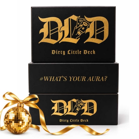 Three black-and-gold Dirty Little Deck game boxes stacked on a white background.